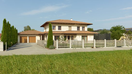 Blick auf das Haus mit umzäunten Garten